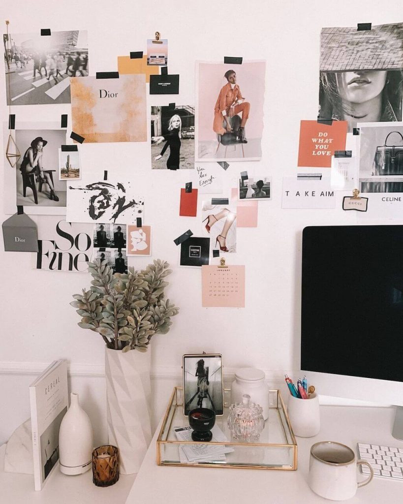 arty wall collage above desk