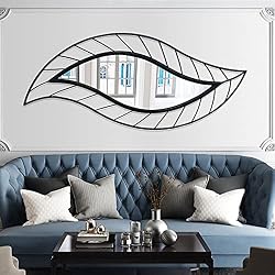 leaf shape mirror above couch