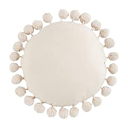 round pillow with pom poms