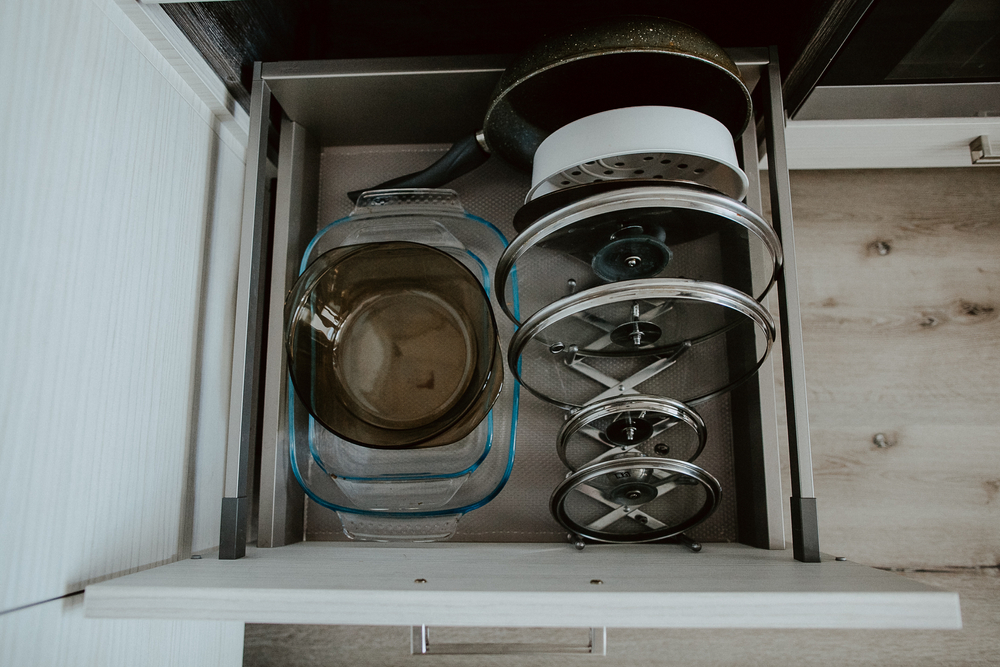 Store pot and pan lids separately in deep drawers Store pot and pan lids separately in deep drawers