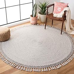 round neutral rug with tassels