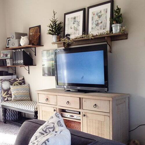 floating shelf over tv